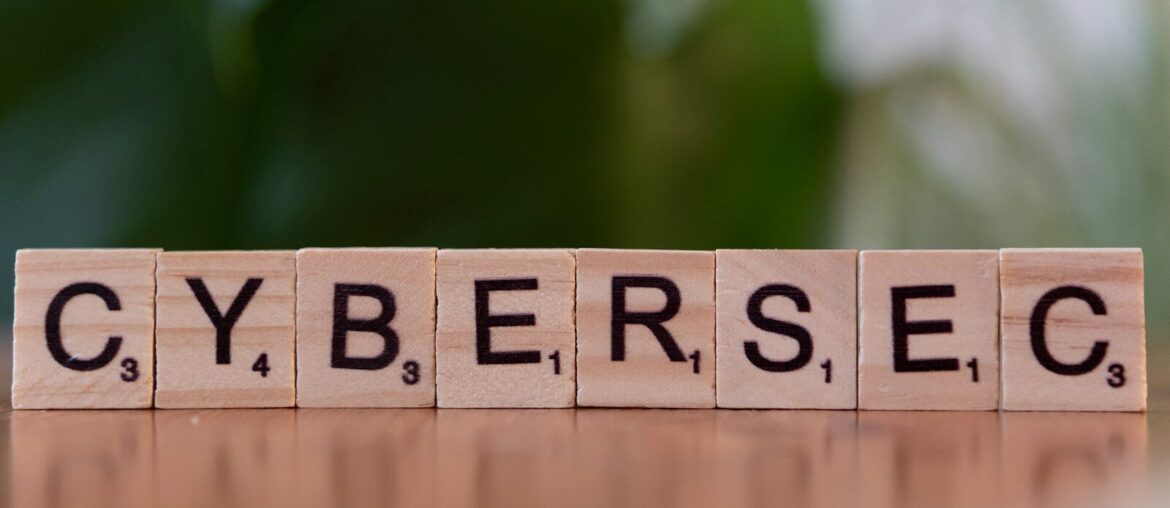 A wooden block spelling cybersec on a table