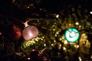 A close up of a christmas ornament on a tree