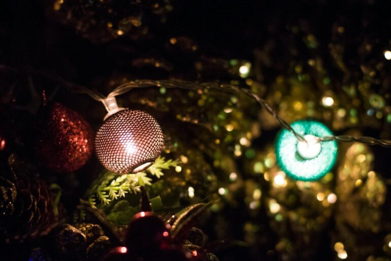 A close up of a christmas ornament on a tree