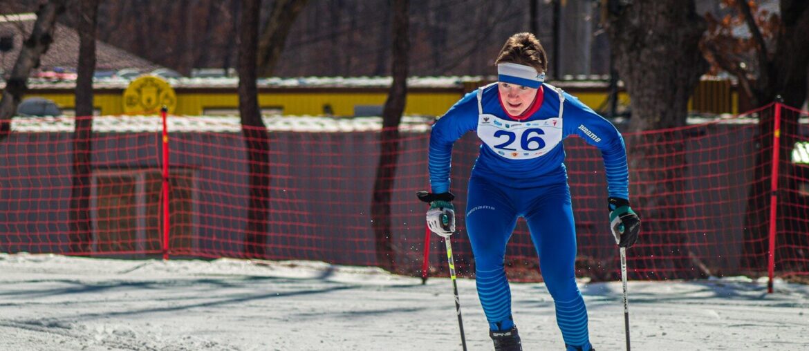 A man riding skis down a snow covered slope
