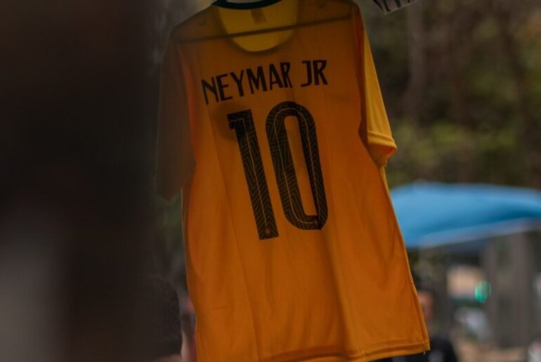 a yellow shirt from a metal pole