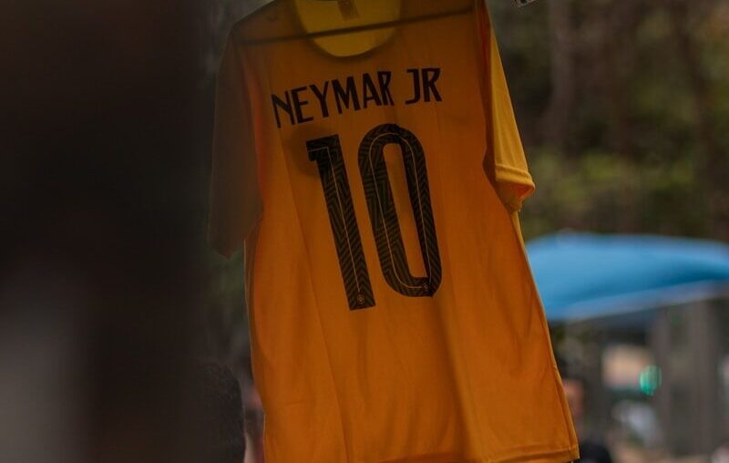 a yellow shirt from a metal pole