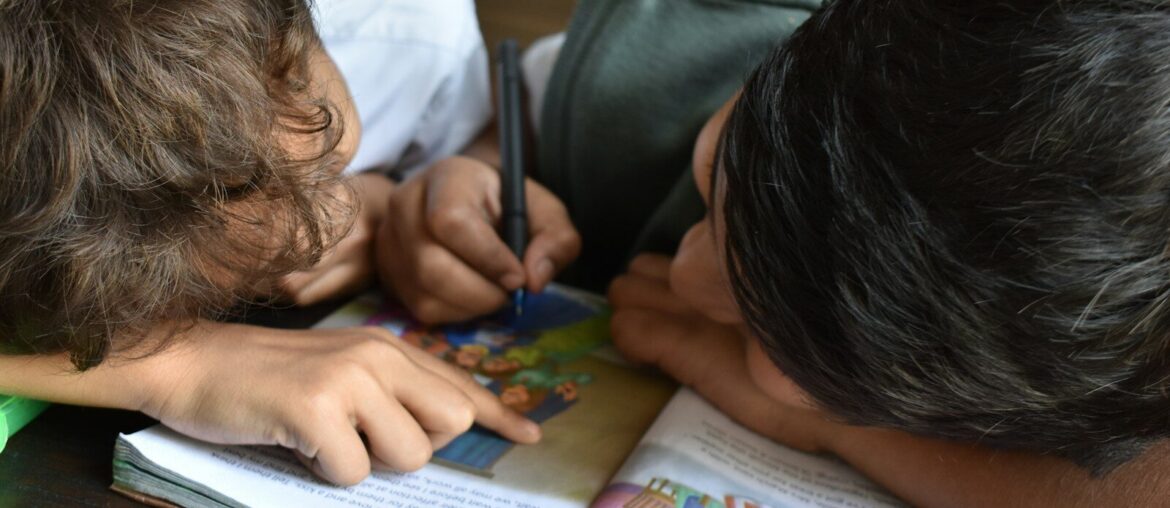 boy's writing on book