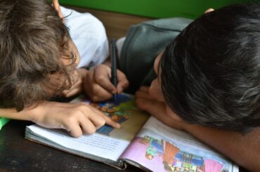 boy's writing on book